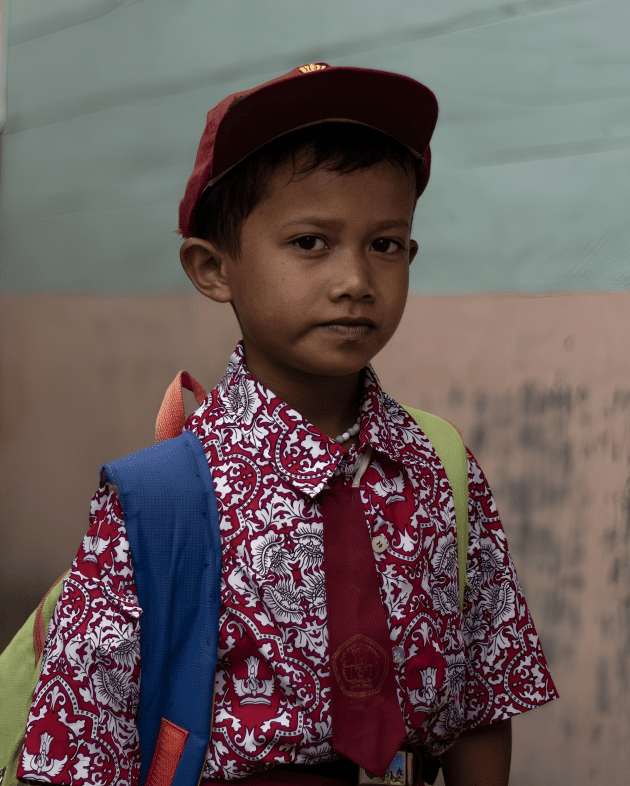 Young schoolboy in uniform with backpack, symbolizing access to education and equal opportunity for every child in India